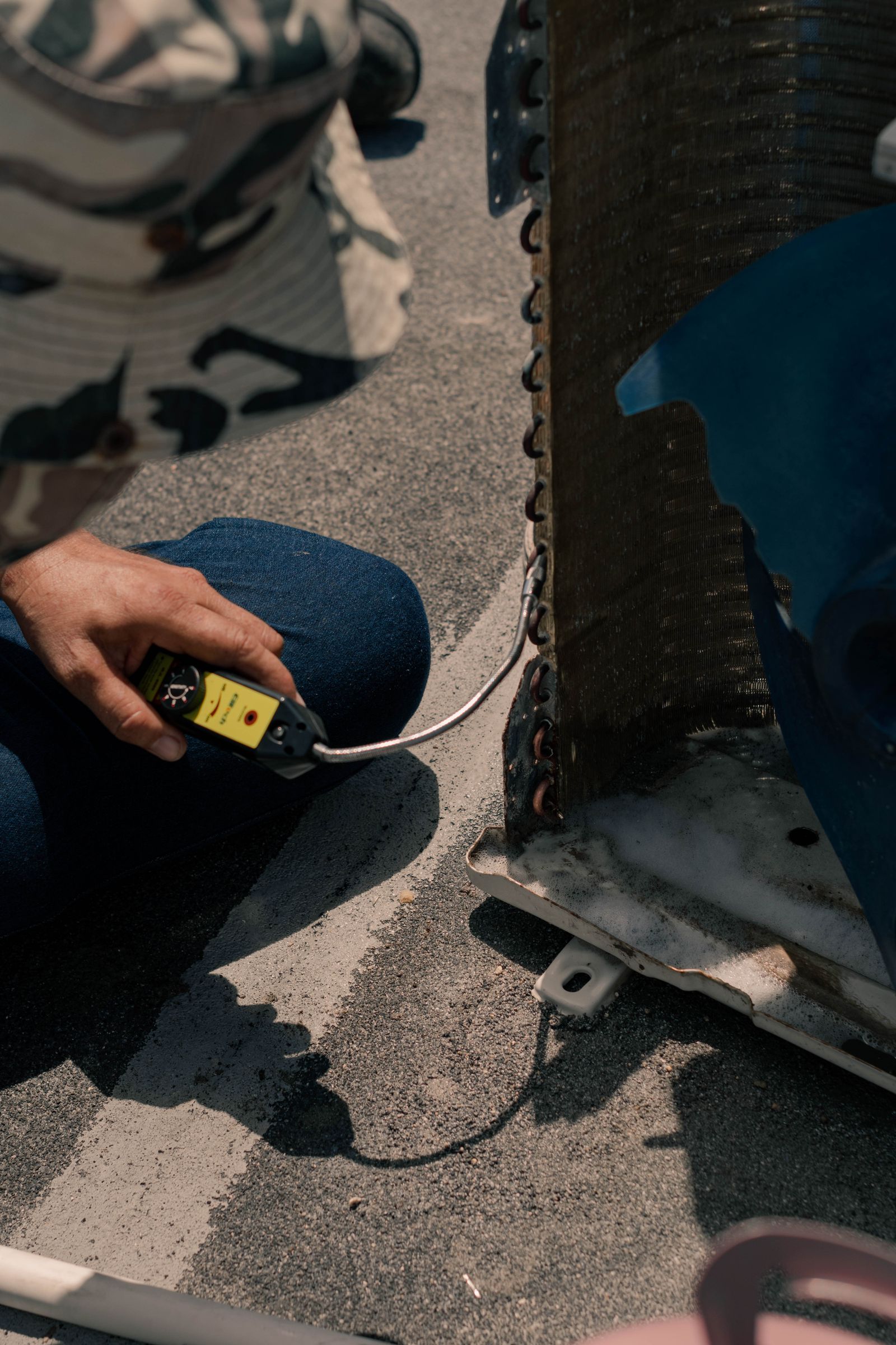 Field technician servicing an HVAC unit on site